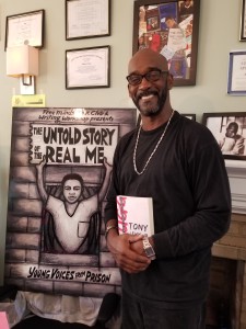 Rod stands in front of a board that says "The Untold Story of the Real Me"